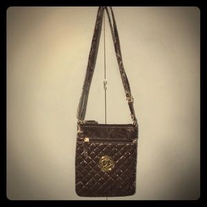 Handbag with adjustable strap.